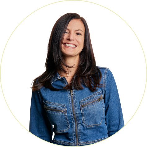 Michelle Gallup, with long, dark hair and denim top, smiling.