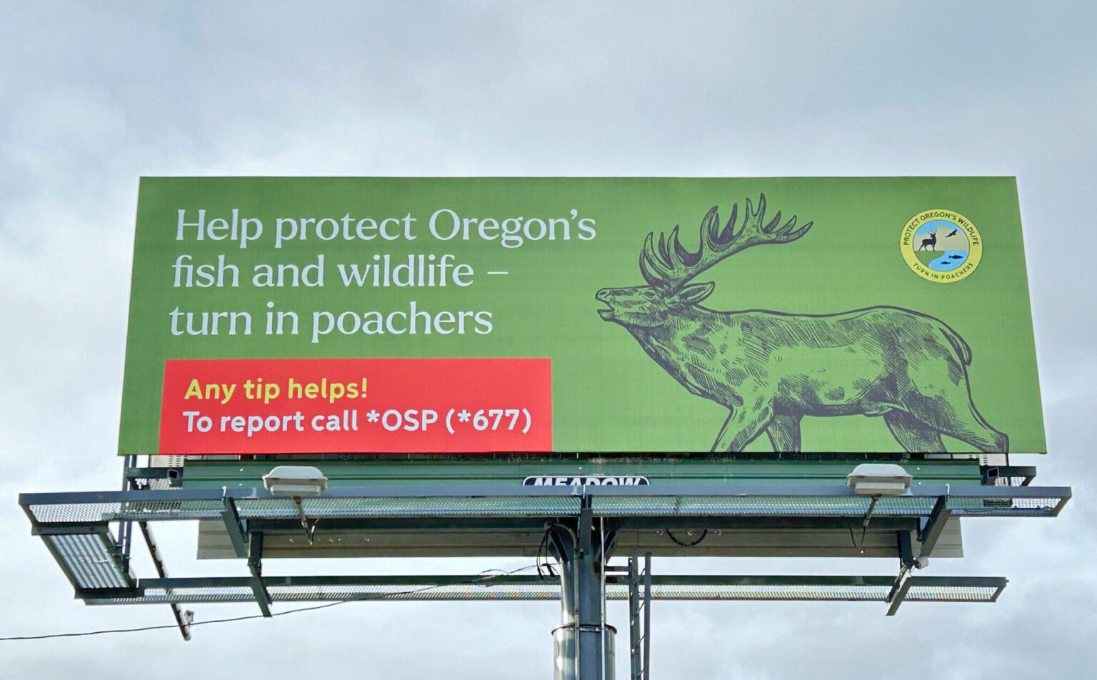 A billboard displaying ODFW creative, Help protect Oregon's fish and wildlife - turn in poachers